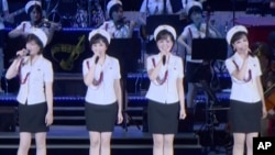 This image made from undated video of a news bulletin aired by North Korea's KRT on July 10, 2017, North Korea's Moranbong Band, an all-female ensemble that was hand-picked by leader Kim Jong Un, performs in Pyongyang. (KRT via AP Video)