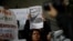 FILE - A woman holds the picture of Mexican journalist Luis Martin Sanchez, whose body was found on the outskirts of the city of Tepic, during a protest on July 10, 2023, to demand justice for him, outside the Interior Ministry building in Mexico City.