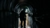 Lt. Col. Ido, whose last name was redacted, walks inside a tunnel underneath the UNRWA compound, where the military discovered tunnels in the main headquarters of the UN agency, during a ground operation in Gaza, Feb. 8, 2024. 