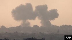 A picture taken from Israel's southern city of Sderot shows smoke billowing during a Israeli strike on Gaza on Oct. 22, 2023, amid ongoing battles between Israel and the Palestinian group Hamas.