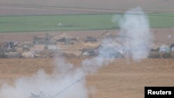Israeli artillery unit fires from the Israeli side of the Israel Gaza border into Gaza, as the conflict between Israel and the Palestinian Islamist group Hamas continues, near the Israel-Gaza border, Oct. 29, 2023.
