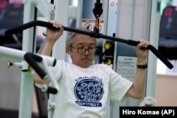 Toshiyuki Honma, 70, uses a lat pulldown machine as he works out at the Fukagawa Sports Center in Tokyo, Wednesday, June 12, 2024. If you are getting up there in years, weight-resistance training might deliver unexpected benefits. (AP Photo/Hiro Komae)