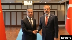FILE - Turkish Foreign Minister Hakan Fidan meets with Chinese Foreign Minister Wang Yi in Ankara, Turkey, July 26, 2023. Fidan wrapped up a three-day visit to China on June 5, 2024. (Pool via Reuters)