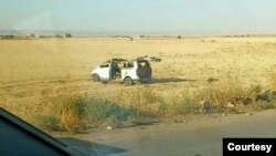 A suspected Turkish drone hit this car carrying a journalist in northeast Syria near the Kurdish city of Qamishli on Aug. 23, 2023. The attack killed the driver and severely injured the journalist. The photo was provided to VOA by a journalist who asked not to be identified.