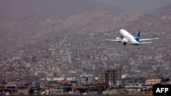 FILE - An Ariana Afghan Airlines aircraft takes off from the airport in Kabul, Sept. 11, 2021.