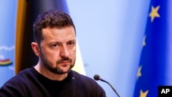 Ukraine's President Volodymyr Zelenskyy takes a question from journalists during a joint news conference with Belgium's Prime Minister Alexander De Croo, not pictured, following their meeting in Brussels, May 28, 2024.