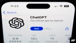 FILE - A ChapGPT logo is seen on a smartphone in West Chester, Pa., Dec. 6, 2023. The World Economic Forum says false and misleading information supercharged with cutting-edge artificial intelligence is the top immediate risk to the global economy. 