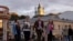 FILE - People walk in the historic district of Podil in Kyiv, Sept. 20, 2023, amid Russia war on Ukraine.
