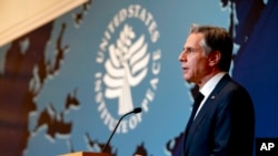 US Secretary of State Antony Blinken speaks at the launch of the US-Afghan Consultative Mechanism with Special Envoy for Afghan Women, Girls, and Human Rights Rina Amiri, July 28, 2022, at the US Institute of Peace in Washington.