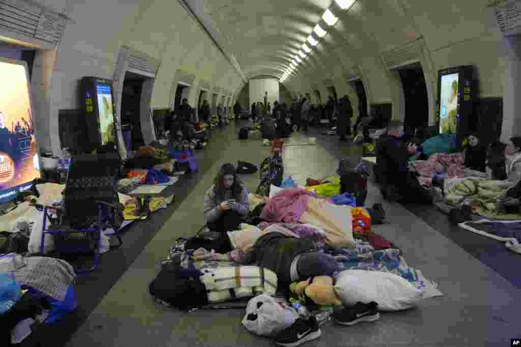 People gather in the Kyiv subway, using it as a bomb shelter, in Kyiv, March 2, 2022.