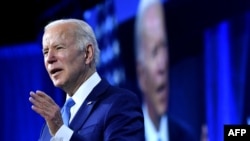 FILE - U.S. President Joe Biden speaks at the National League of Cities Congressional City Conference at the Marriott Marquis in Washington, March 14, 2022. 