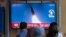 A TV screen showing a news program reporting about North Korea's missile launch with file footage, is seen at the Seoul Railway Station in Seoul, South Korea, Oct. 4, 2022