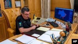 FILE - The head of Ukraine's powerful National Security and Defense Council, Oleksiy Danilov, is seen at his office in Kyiv, Ukraine, Sept. 2, 2022. 