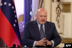 International Criminal Court prosecutor Karim Khan speaks at the Miraflores presidential palace in Caracas, March 31, 2022. (Photo by Zurimar Campos / Venezuelan Presidency / AFP)