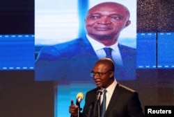 FILE - Emmanuel Ramazani Shadary, Congolese Presidential candidate for the ruling Common Front of Congo (FCC) coalition announces his political manifesto in Kinshasa, Democratic Republic of Congo Nov. 19, 2018.