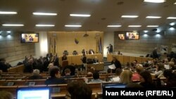 Iraqi security forces block a road leading to the Green Zone in Baghdad as lawmakers gather for their fourth attempt this year to elect a new state president and break political gridlock that has sparked deadly violence.