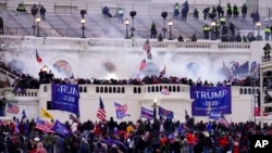 FILE - Supporters of President Donald Trump storm the Capitol, Jan. 6, 2021, in Washington.