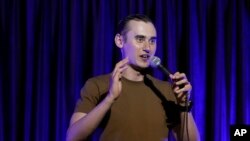 Serhiy Lipko performs in a stand-up comedy show in Kyiv, Ukraine, Saturday, June 11, 2022. (AP Photo/Natacha Pisarenko)
