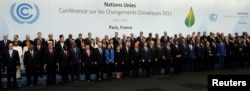 World leaders pose for a family photo during the opening day of the World Climate Change Conference 2015 (COP21) at Le Bourget, near Paris, France, November 30, 2015.