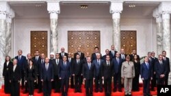 In this photo provided by Egypt's presidency media office, Egyptian President Abdel-Fattah el-Sissi, center, poses with Egypt's new cabinet, led by Prime Minister Mostafa Madbouly, at Al-Ittihadiya Palace in Cairo, Egypt, July 3, 2024.
