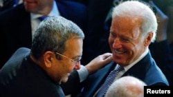 Uruguay's Diego Godin, second right, heads the ball to score his side's first goal during the group D World Cup soccer match between Italy and Uruguay at the Arena das Dunas in Natal, Brazil.