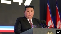 In this photo provided by the North Korean government, North Korean leader Kim Jong Un delivers a speech during an opening ceremony of a defense exhibition in Pyongyang, North Korea, Nov. 21, 2024. 