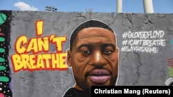 A mural depicts George Floyd, who died in Minneapolis police custody, in Berlin, Germany.