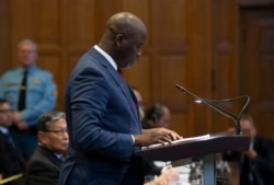 Gambia's Justice Minister Aboubacarr Tambadou addresses judges of the International Court of Justice for the first day of three days of hearings in The Hague, Netherlands, Tuesday, Dec. 10, 2019.