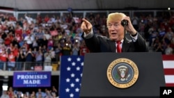President Donald Trump speaks at a rally at AMSOIL Arena in Duluth, Minnesota, June 20, 2018. 