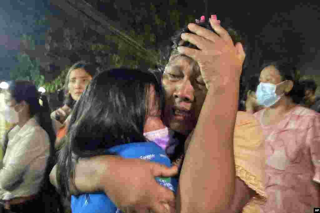 A mother reacts after her daughter, left, was released from Insein Prison in Yangon, Myanmar.&nbsp;Myanmar's government announced an amnesty for more than 5,600 people arrested for taking part in anti-coup protests. Over 1,000 people were freed from prisons around the country and charges against more than 4,000 others were suspended.&nbsp;