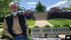 Retiree Bob Coleman poses for a picture Thursday, May 7, 2020, in Franklin, Tennessee. Coleman is one of several retirees who have turned into DJs for a new online radio hour known as “Radio Recliner.” (AP Photo/Kimberlee Kruesi)