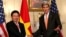 U.S. Secretary of State John Kerry (R) shakes hands with Vietnamese Deputy Prime Minister and Foreign Minister Pham Binh Minh before a working lunch at the State Department in Washington October 2, 2014. 