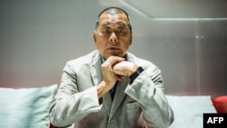 FILE - In this picture taken on June 16, 2020, media tycoon Jimmy Lai poses during an interview with AFP at the Next Digital offices in Hong Kong.