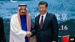 Saudi King Salman, left, and Chinese President Xi Jinping shake hands in Beijing, China, March 16, 2017.