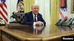 Дональд Трамп в Овальном кабинете Белого дома, 23 января 2025 года. REUTERS/Kevin Lamarque.