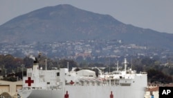The USNS Mercy, a Navy hospital ship, is seen docked at Naval Base San Diego, March 18, 2020.