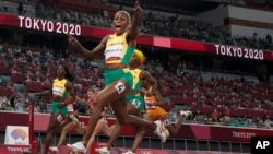 Elaine Thompson-Herah, of Jamaica, wins the women's 100-meter final at the 2020 Summer Olympics, Saturday, July 31, 2021, in Tokyo. (AP Photo/Petr David Josek)