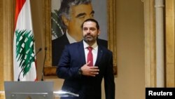 Lebanon's Prime Minister Saad Hariri gestures as he leaves after delivering his address in Beirut, Lebanon, Oct. 29, 2019. 