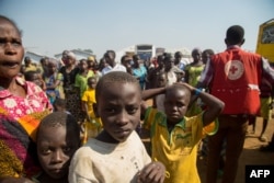 FILE - New Congolese refugees arrive at a refugee settlement in Kyangwali, Uganda, on Feb. 16, 2018.