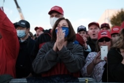 Hundreds arrive for a President Donald Trump rally in support of Republican Senators David Perdue and Kelly Loeffler on Dec. 5, 2020, in Valdosta, Georgia.