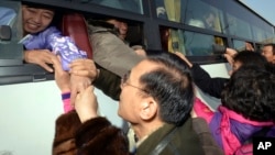 Many South Koreans have held reunions with North Korean family members since the '80s, as these people did in North Korea in February 2014, but the U.S. has not arranged meetings between Korean-Americans and their North Korean relatives. 