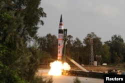 FILE - A surface-to-surface Agni V missile is launched from the Wheeler Island off the eastern Indian state of Odisha, April 19, 2012.