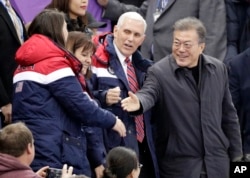 U.S. Vice President Mike Pence and South Korean President Moon Jae-in attend the women's 500-meter short-track speedskating event in the Gangneung Ice Arena at the 2018 Winter Olympics in Gangneung, South Korea, Feb. 10, 2018.