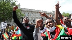 FILE - People gather to protest against the treatment of Ethiopia's ethnic Oromo group, outside Downing Street in London, Britain, July 3, 2020. 