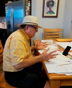In this April 27, 2020 photo provided by Luckie, Ed Rosenblatt records audio for the "Radio Recliner" show at Somerby Sandy Springs, outside Atlanta. Rosenblatt is one of several retirees who have turned into DJs for the new online radio hour.