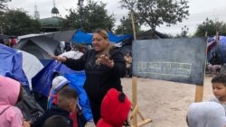 Wendy Yhoana Castellon Leiva, 40, teaches elementary math class at the Sidewalk School. (Dylan Baddour/VOA)