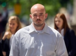 FILE - In this June 11, 2014 file photo, former Blackwater guard Nicholas Slatten leaves federal court in Washington, after the start of his first-degree murder trial.
