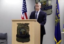 FILE - Portland Deputy Police Chief Chris Davis speaks during a news briefing in Portland, Ore., July 8, 2020.