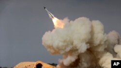 FILE - In this Dec. 29, 2016 file photo, released by the semi-official Iranian Students News Agency (ISNA), a long-range S-200 missile is fired in a military drill in the port city of Bushehr, on the northern coast of Persian Gulf, Iran.