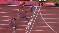 Lamont Marcell Jacobs, of Italy, wins the final of the men's 100-meters at the 2020 Summer Olympics, Sunday, Aug. 1, 2021, in Tokyo, Japan. (AP Photo/Francisco Seco)